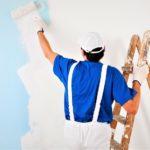 painter painting with paint roller